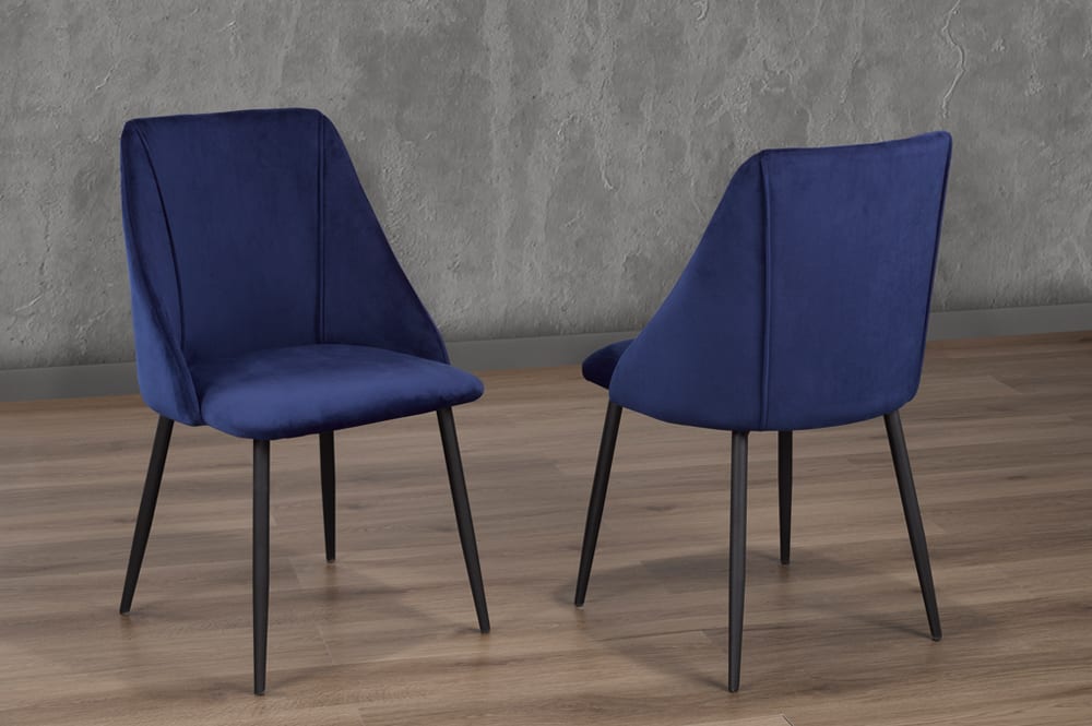 Blue velvet dining chair with cushioned seat and back