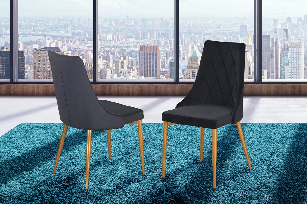 Set of 2 black velvet dining chairs with gold legs and cushioned back