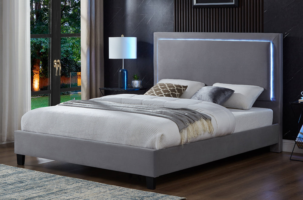 Grey velvet king bed with tufted design and LED headboard